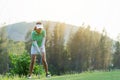 Golfer sport course golf ball fairway.ÃÂ  People lifestyle woman playing game golf tee of on the green grass.ÃÂ  Royalty Free Stock Photo